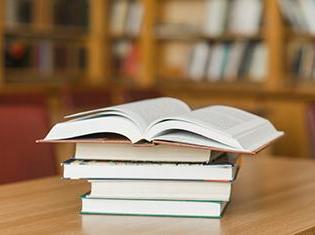 Stack of books on library desk